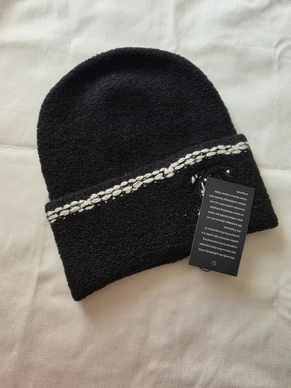 Black Knit Beanie with Cream Braided Trim and Patch